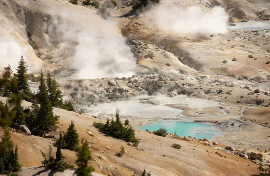 A mountain, trees and volcanic activity.