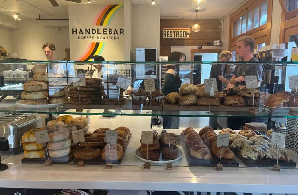 A lot of pastries at a cafe.